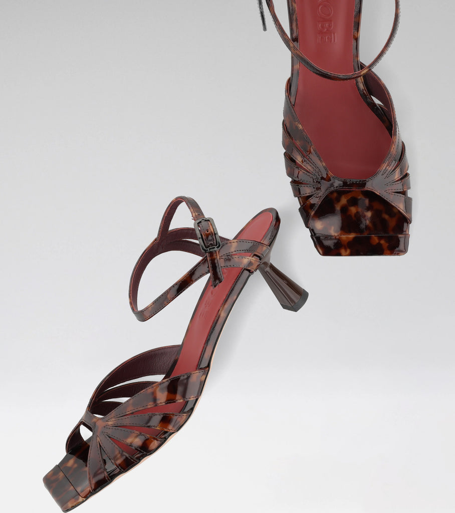 GIOIA leopard leather sandal with curved straps, squared toe and 60 mm heel.