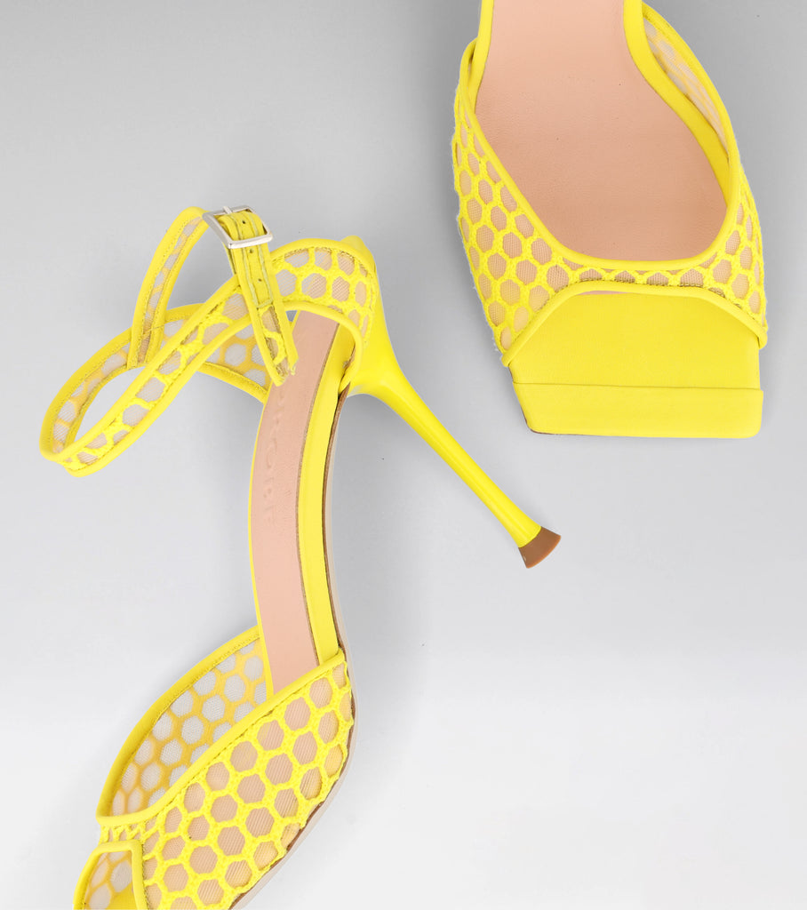 High heel sandal in rete material in bright yellow 